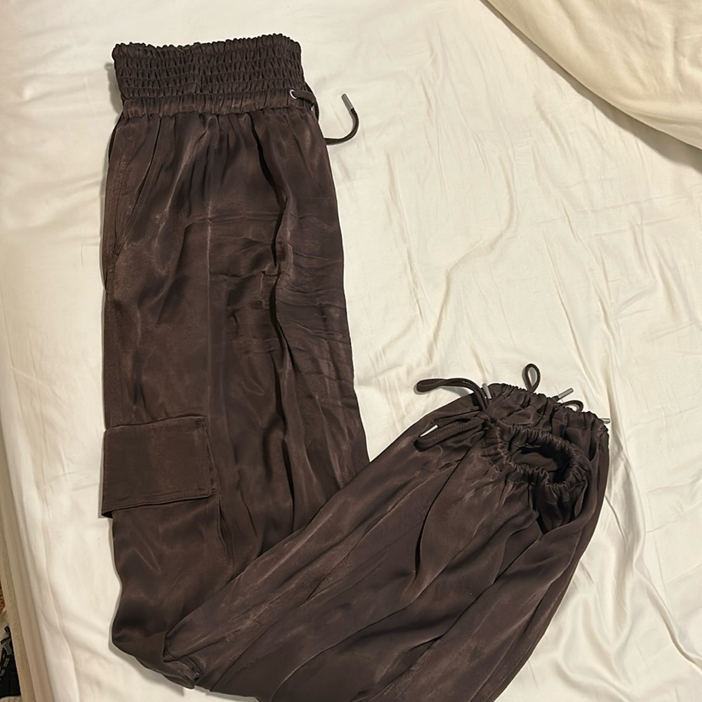 Chocolate brown satin cargo pants from Anthropologie with elastic ankles